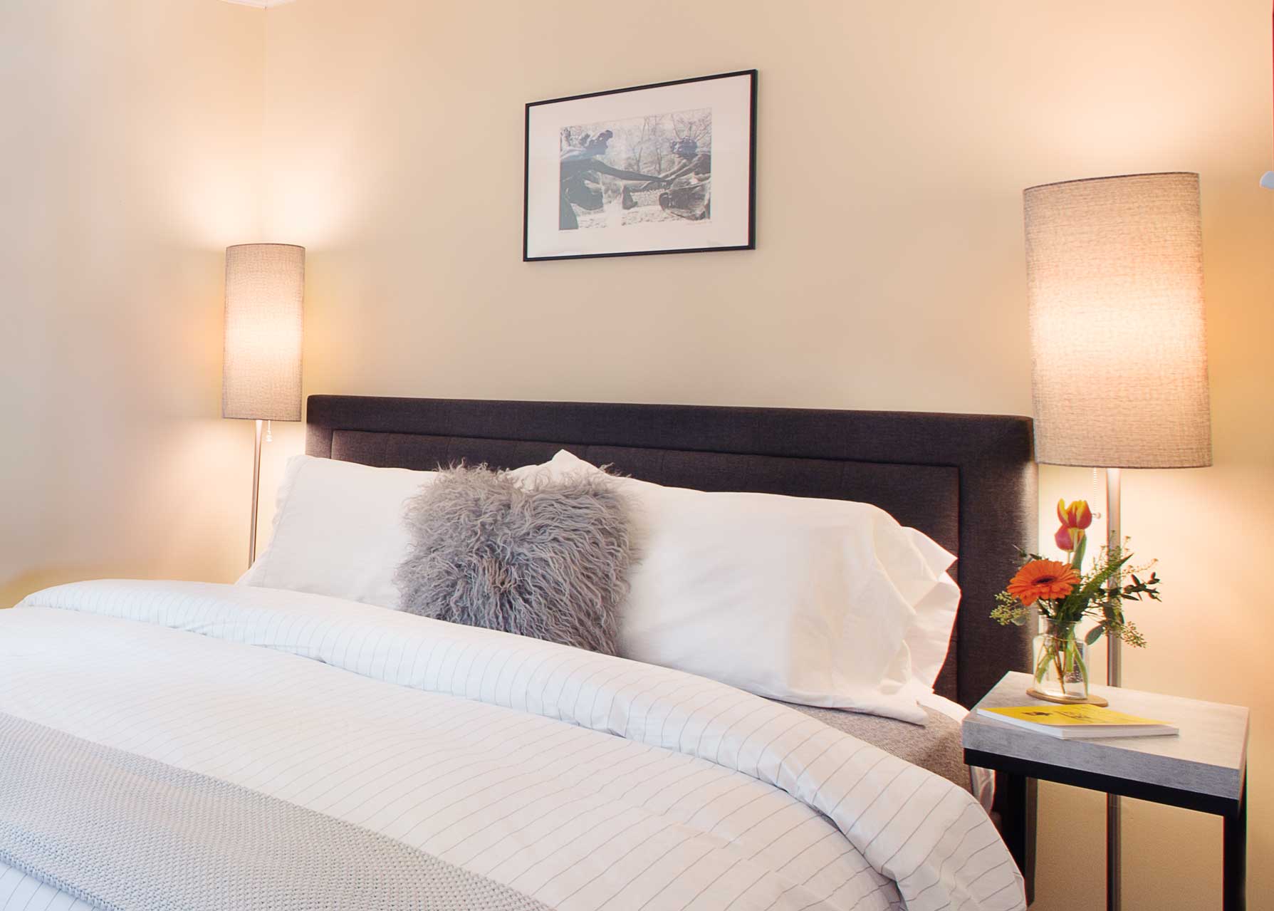 The grey bedroom is a delight of textures.